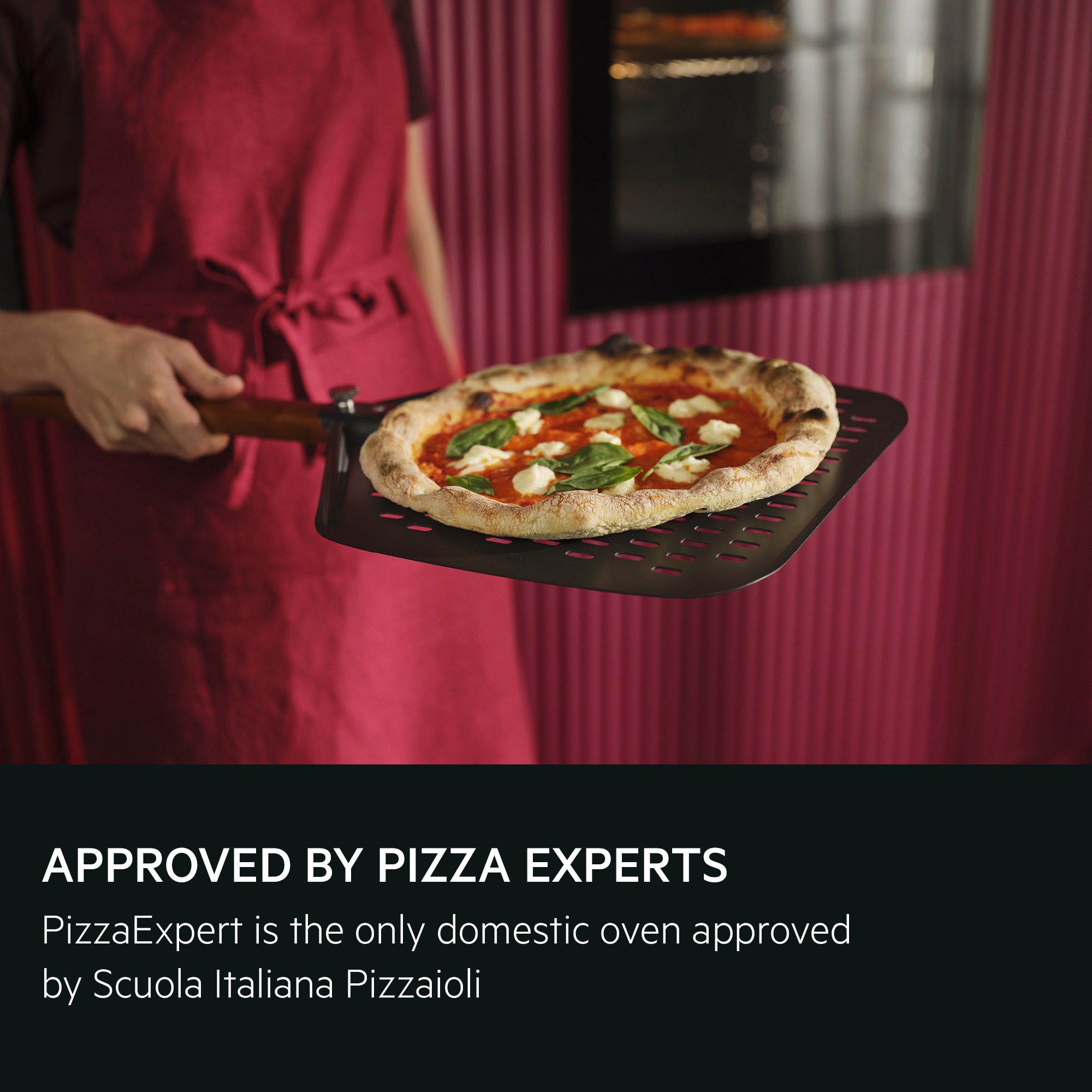 Person holding the pizza expert pizza peel with a Neapolitan pizza
