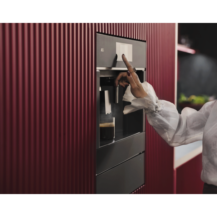 Built-in coffee machine designed to fit flush with kitchen cabinetry for a streamlined look.