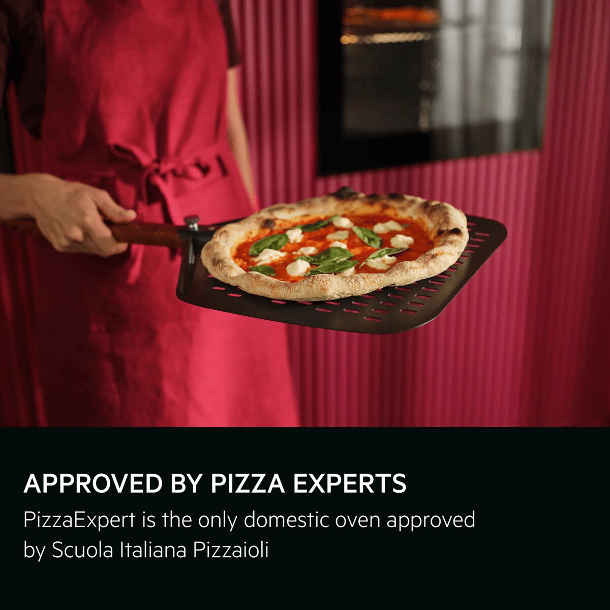 Person holding the pizza expert pizza peel with a Neapolitan pizza