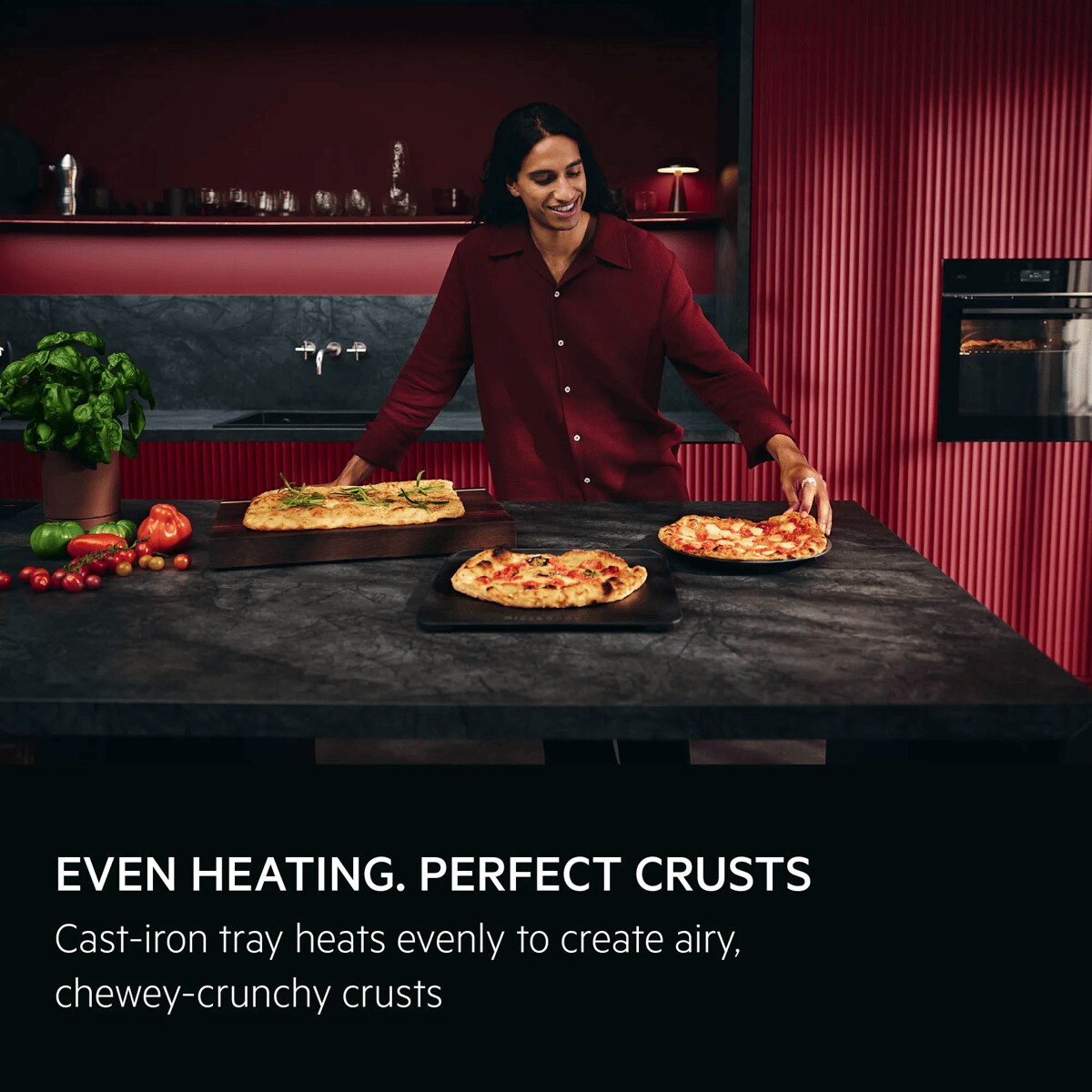 Person with the pizza expert oven and cast iron tray with Neapolitan pizzas 
