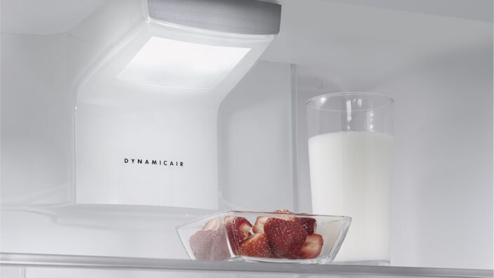 Strawberries and milk in kitchen