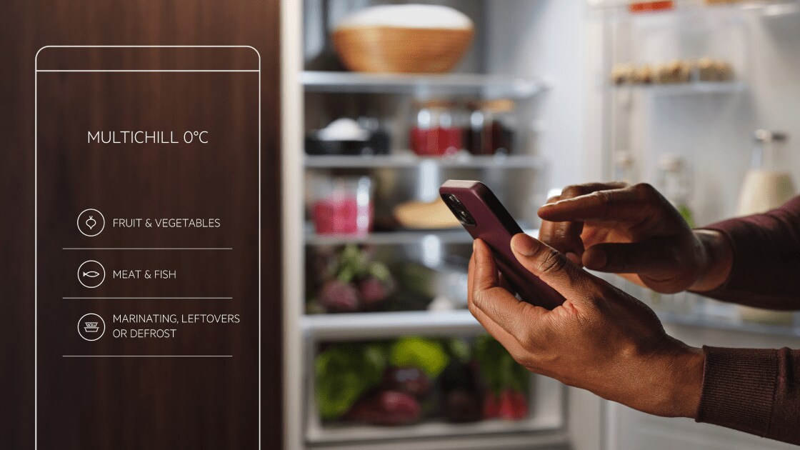 Smart phone in front of a fridge