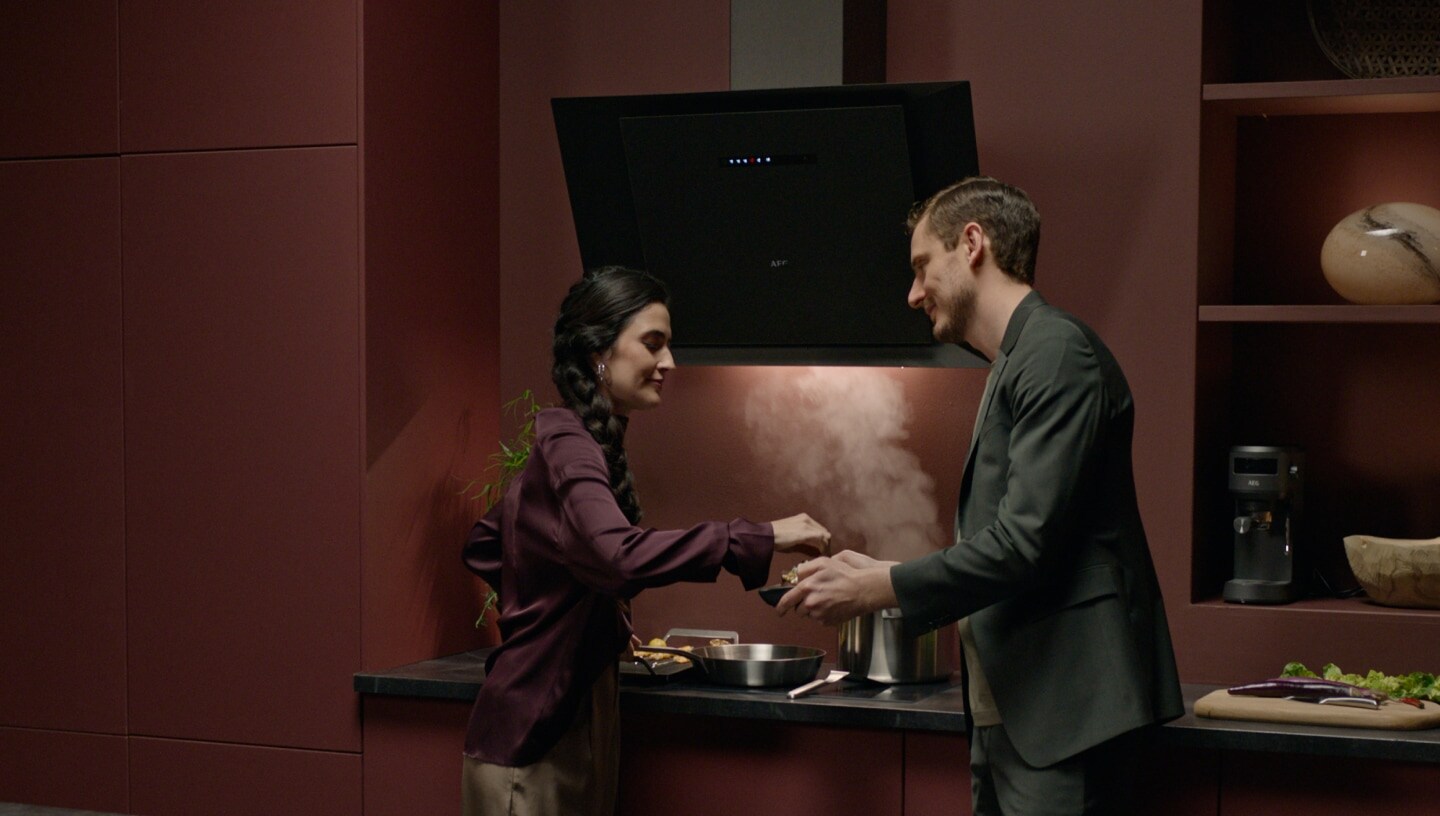 Man and woman in a modern kitchen.