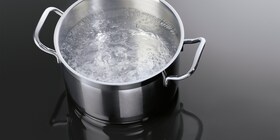 A pan of boiling water on an AEG induction hob