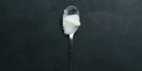 A spoon with white gelatine