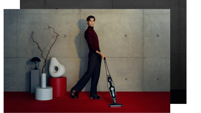 Man with cordless vacuum cleaner