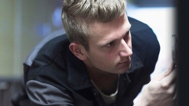 Technician looking at an AEG appliance