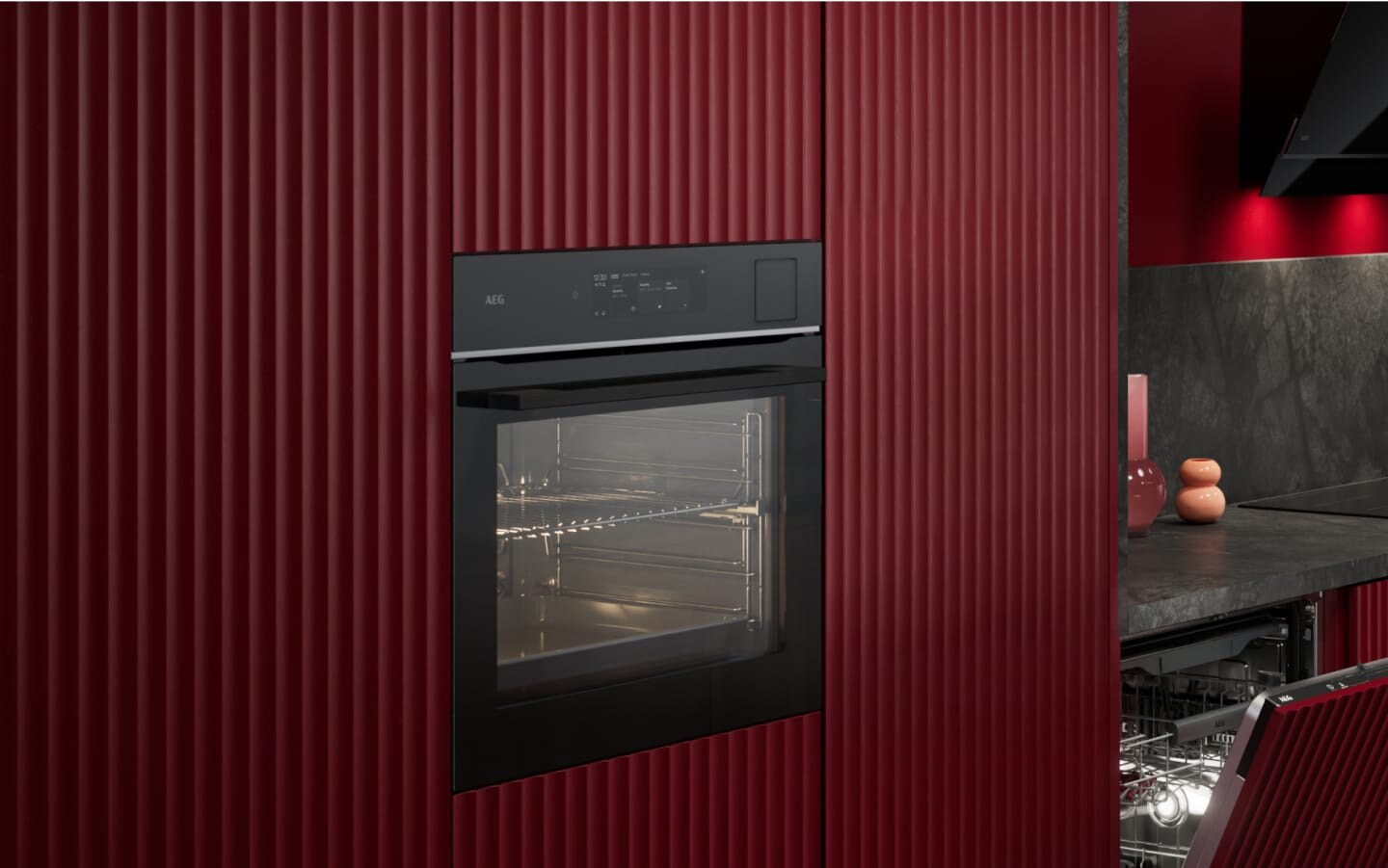 An oven in a red kitchen.