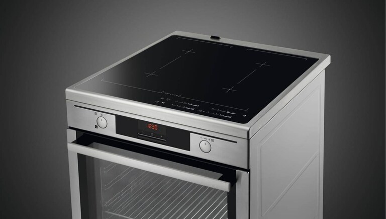 AEG cooker displayed against a grey background.