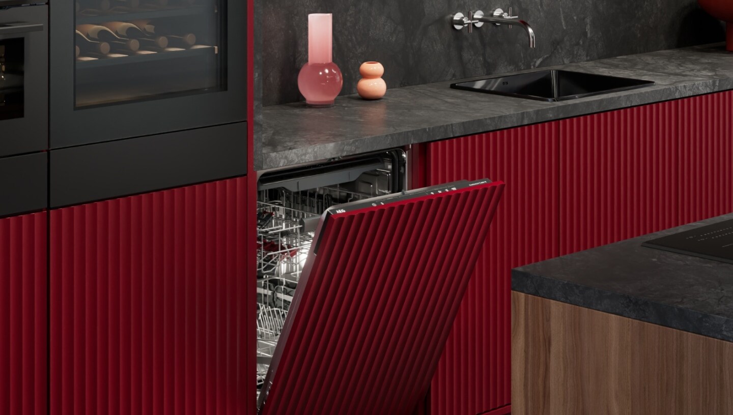 AEG integrated dishwasher in a red kitchen