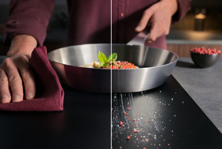 hands cooking and cleaning on induction hoob