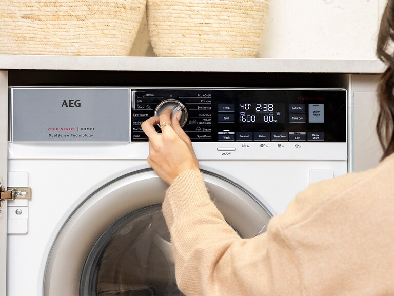 women using a washing machine
