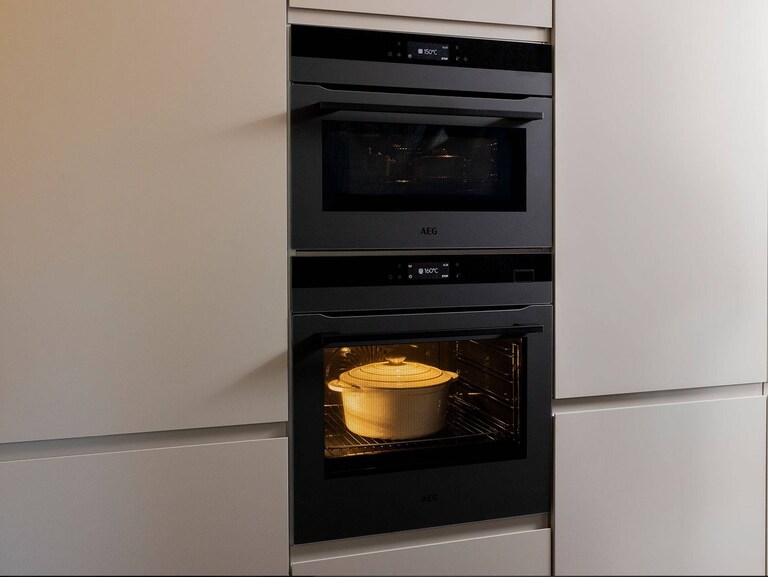 kitchen with double oven with pot inside