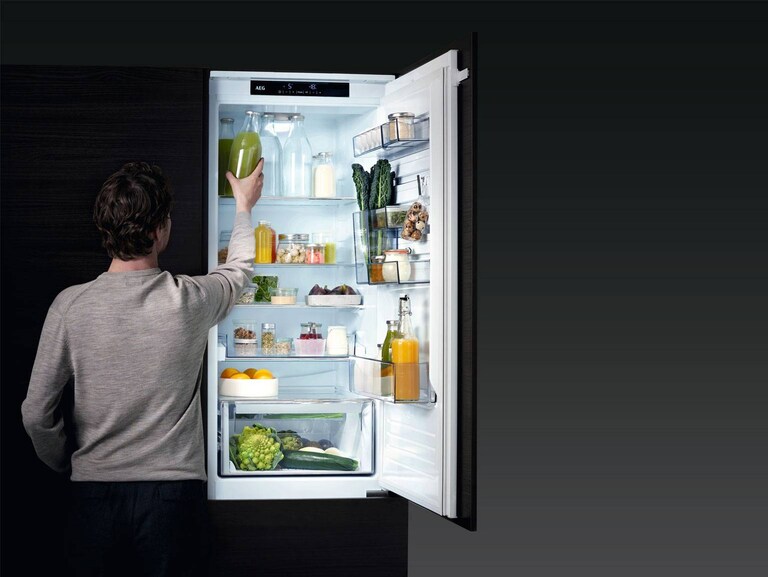 man opening the fridge