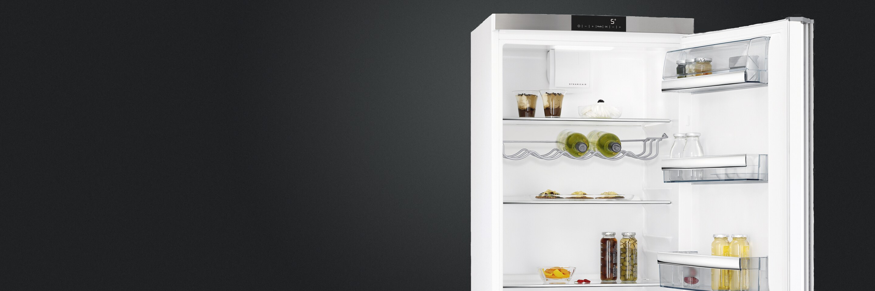 freestanding refrigerator with open door displaying wine & food being cooled